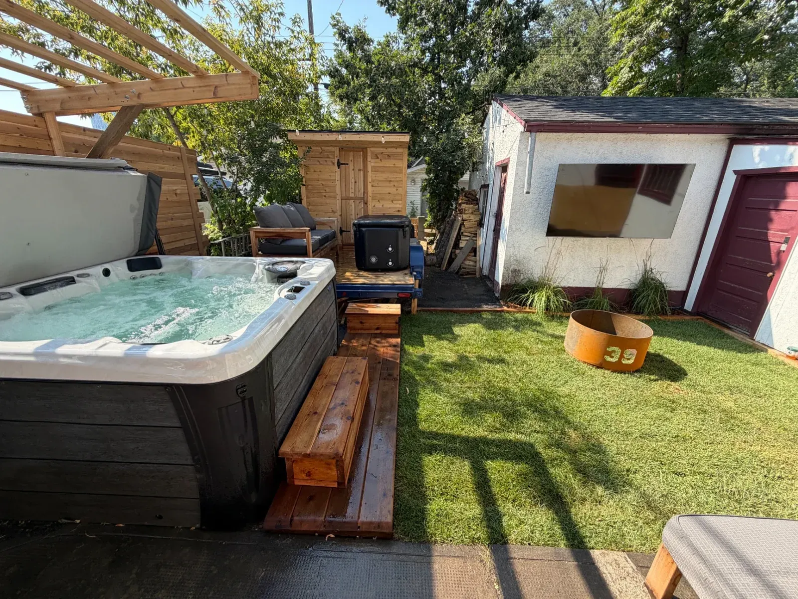 The firepit and lounge seating in the Merlot House backyard